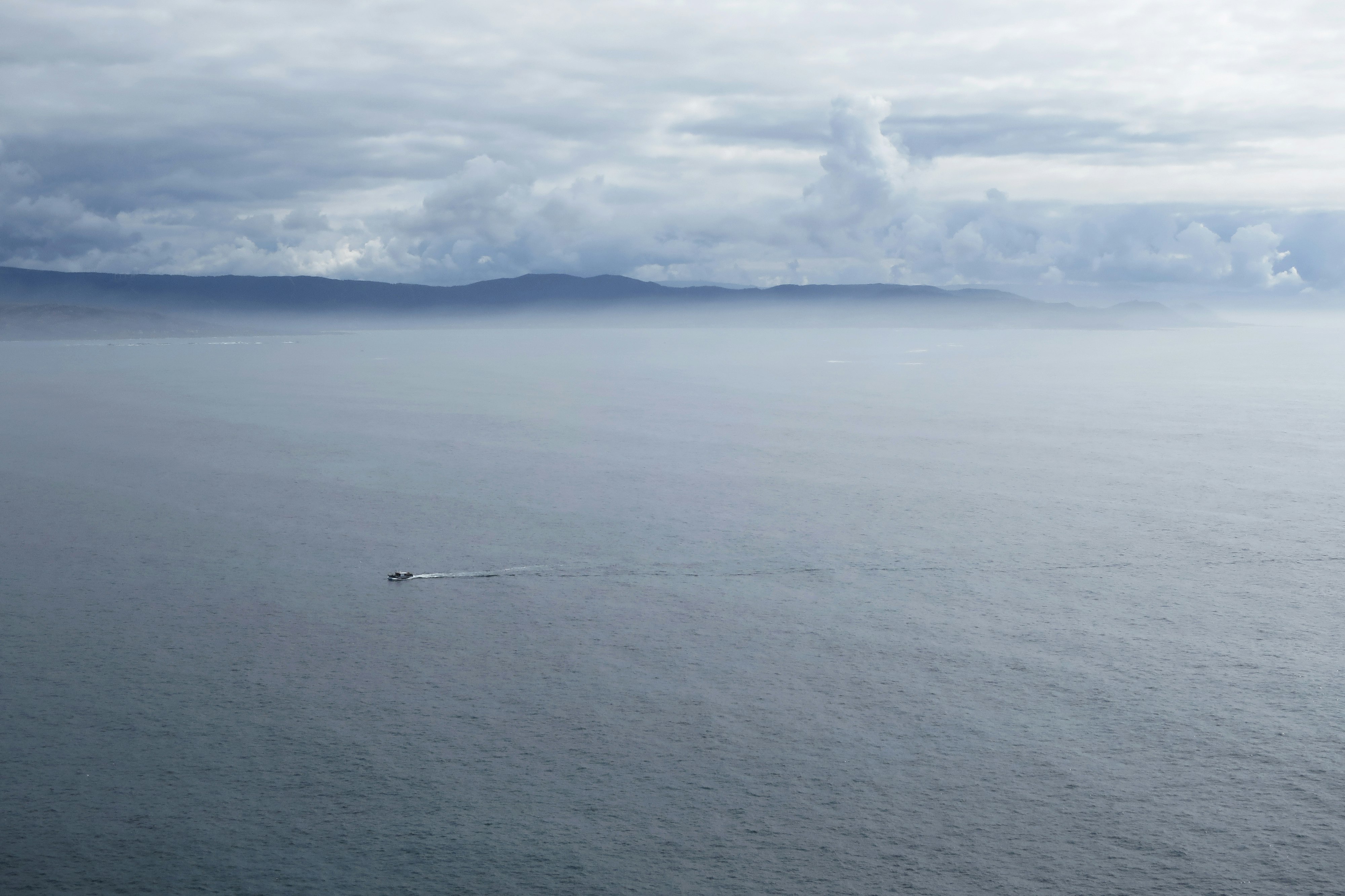 white clouds over blue sea